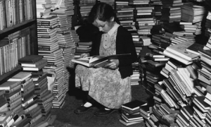 little girl reading books